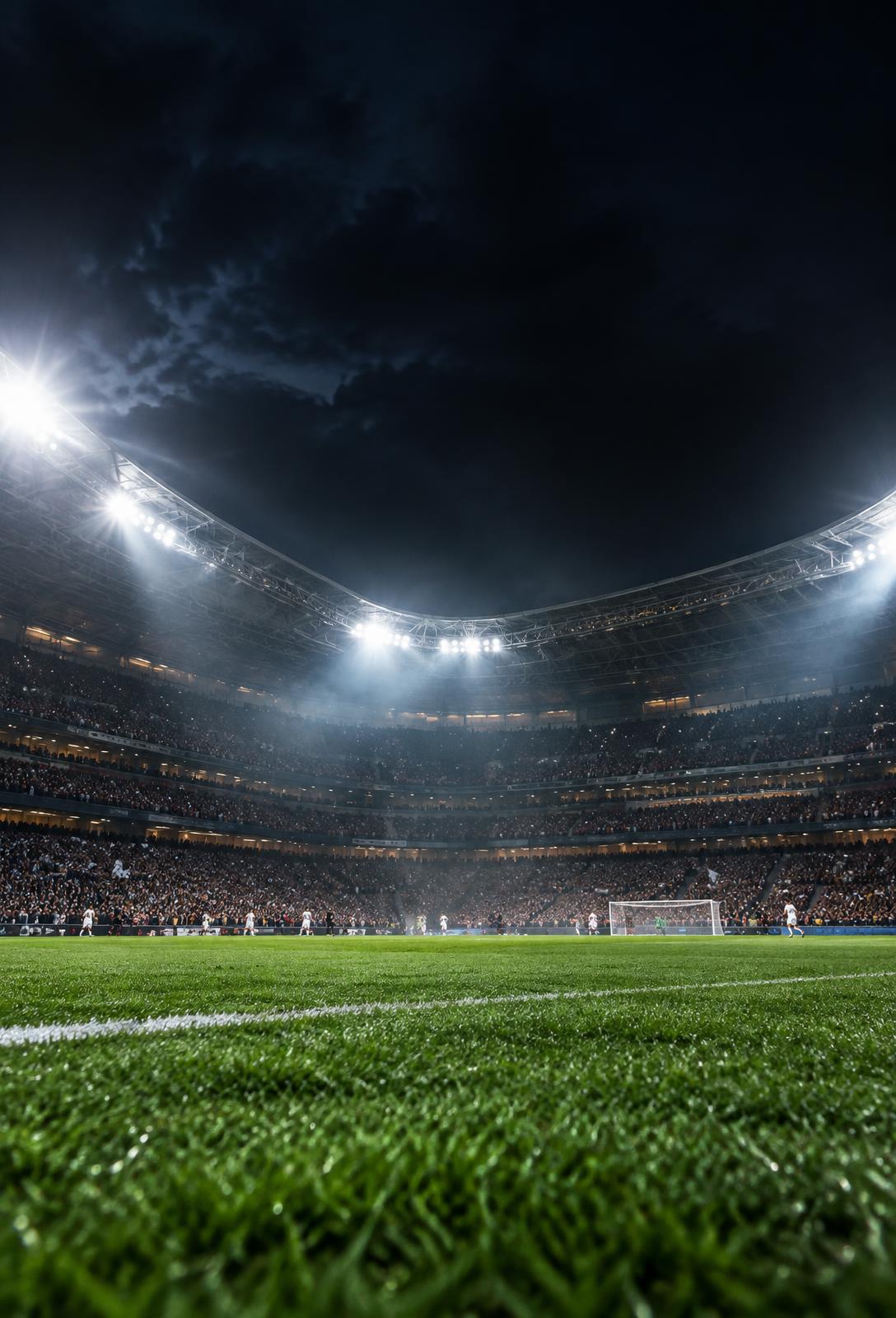 Floodlit football stadium on a matchday night